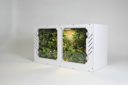 White PVC Reptile Enclosure with displaying green plants on a white background