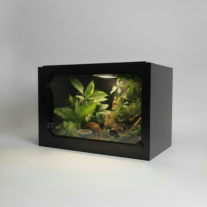 Small pvc reptile enclosure with plants and rocks on a gray background