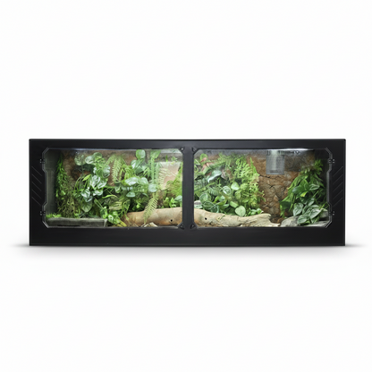 PVC reptile terrarium with green plants and a log on a white background