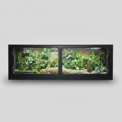 PVC reptile enclosure terrarium with plants and rocks on a gray background