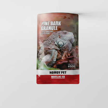 A stand-up pouch of Nomy Pet Pine Bark Granules dog food, featuring a realistic bark texture graphic on the front with a red top band and white text, shown on a plain white background.