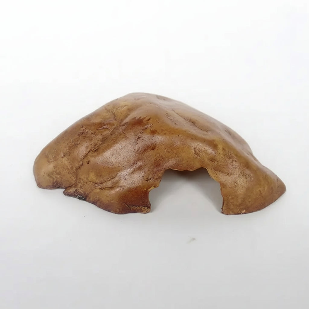A small brown textured hide or shelter toy made of molded material, shown on a plain white background.