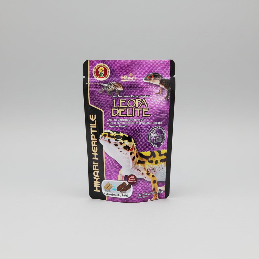 A stand-up pouch of Hikari Herptile Leopa Delite food, featuring a purple and black design with leopard illustrations, photographed on a neutral gray background.
