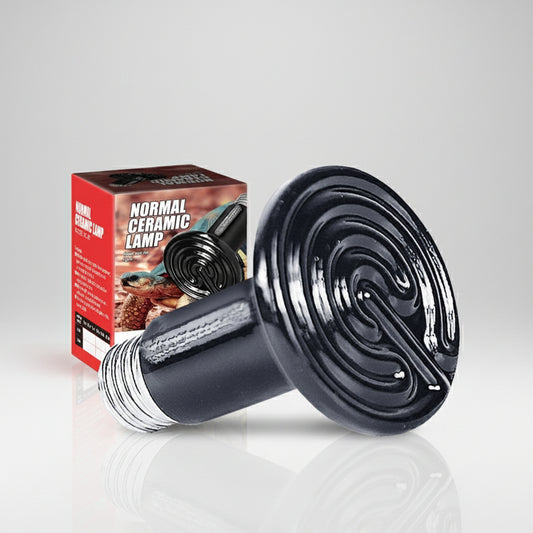 A black ceramic infrared heat lamp with a silver metal screw base, shown next to its red and black retail box on a light gray reflective surface.