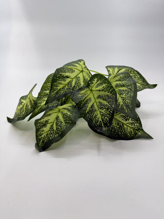 Lifelike Caladium artificial plant providing vibrant decor in a reptile enclosure.