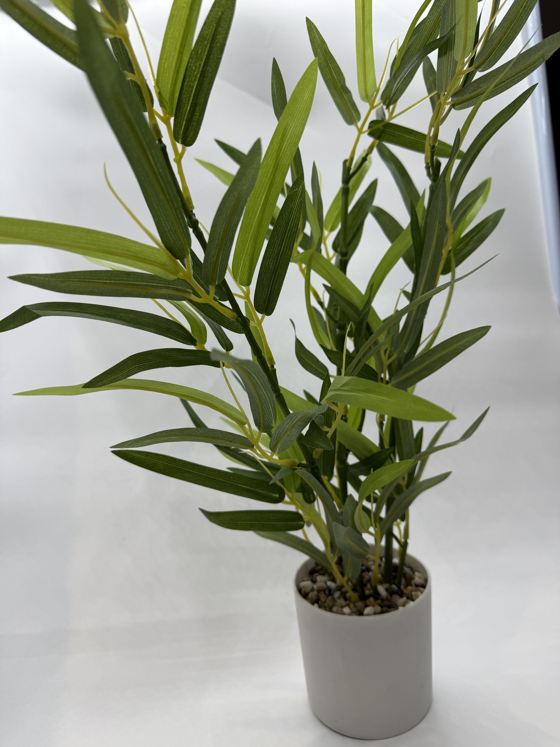 Detailed faux Tarragon leaves creating a natural look in terrariums.