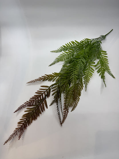 Lifelike Drooping Spleenwort artificial plant creating a natural jungle look in a reptile enclosure.