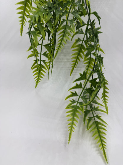 Realistic Pteris Quadriaurita artificial fern in a tropical reptile enclosure.