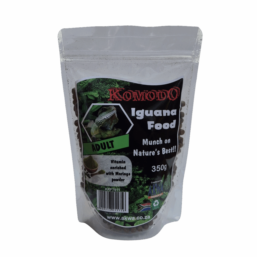A stand-up resealable pouch of Komodo Iguana Food Adult, containing dark pellets, with a black and green label on a light gray background.