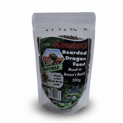 A 350g stand-up pouch of Komodo Bearded Dragon Food (Juvenile) containing dark brown pellets, shown on a white background with a soft shadow.