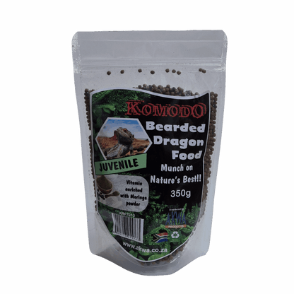 A 350g stand-up pouch of Komodo Bearded Dragon Food for juveniles, filled with dark brown pellets, shown against a light gray background.