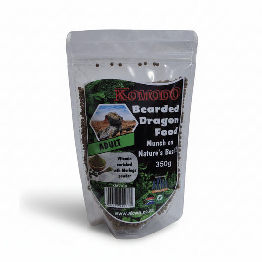 A 350g stand-up pouch of Komodo Bearded Dragon Food for adults, shown against a solid gray background.