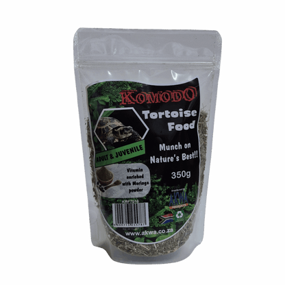 A 350g stand-up pouch of Komodo Tortoise Food, featuring a black and green label with a picture of a tortoise and product details, set against a light gray background.