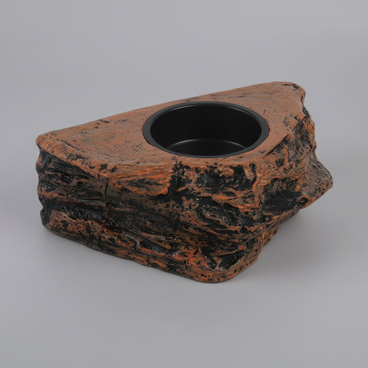 Decorative rock-shaped feeding bowl with a black interior on a white background