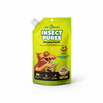 A bright lime green stand-up pouch of APT. THE ZOO Insect Puree Banana Paste, featuring a cartoon illustration of a green bug and a banana, on a plain white background.