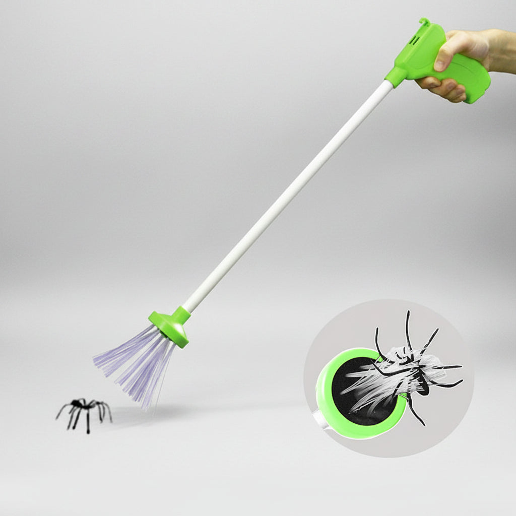 A handheld long-handled bug and spider trap with a bright green handle, white shaft, and purple sticky brushes at the tip. A hand is holding the top, and a small spider is shown near the trap, with a circular inset demonstrating the trapping effect.
